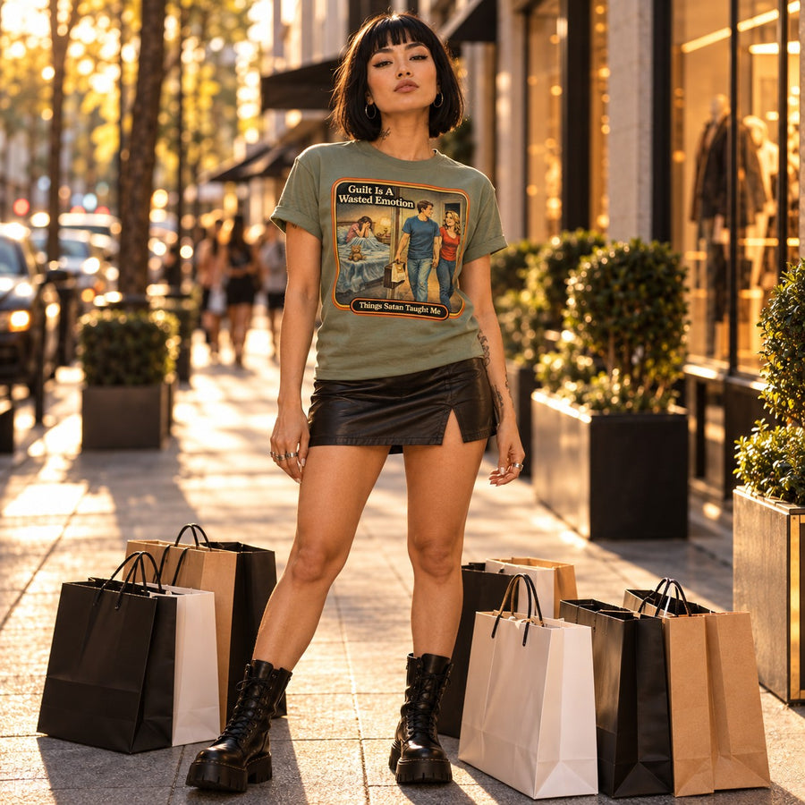Model wearing the Guilt Is A Wasted Emotion tee in sage by Things Satan Taught Me