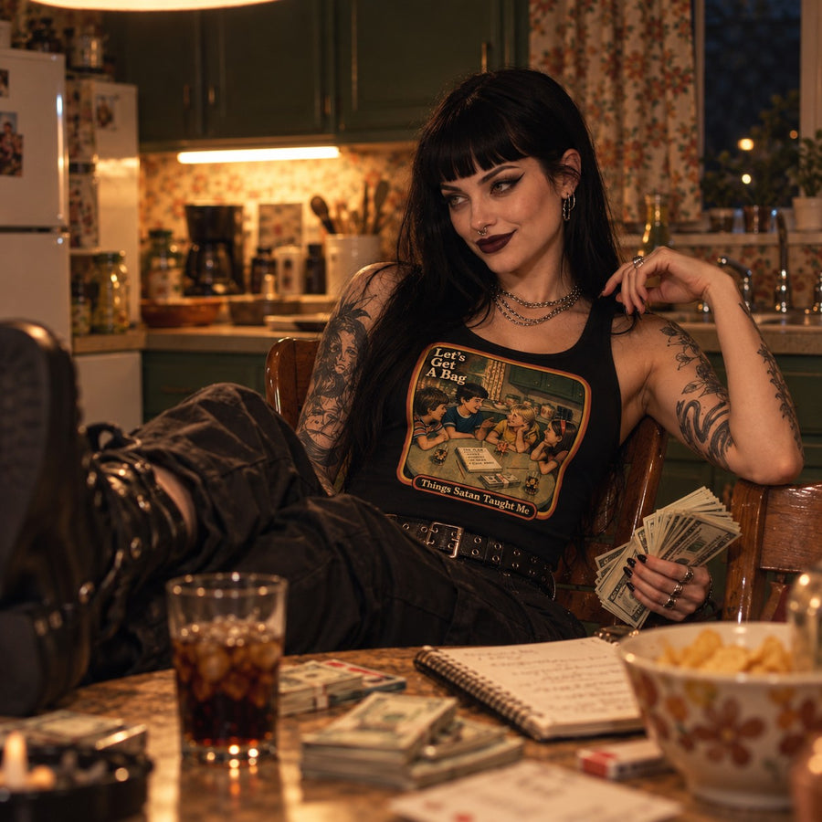Model sitting in the Let's Get Another Bag tank in black by Things Satan Taught Me