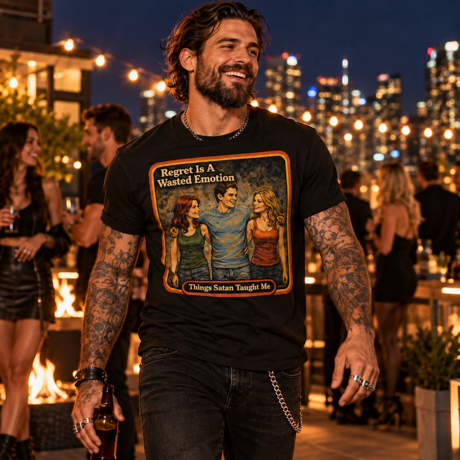 Model walking in the Regret Is A Wasted Emotion tee in black by Things Satan Taught Me