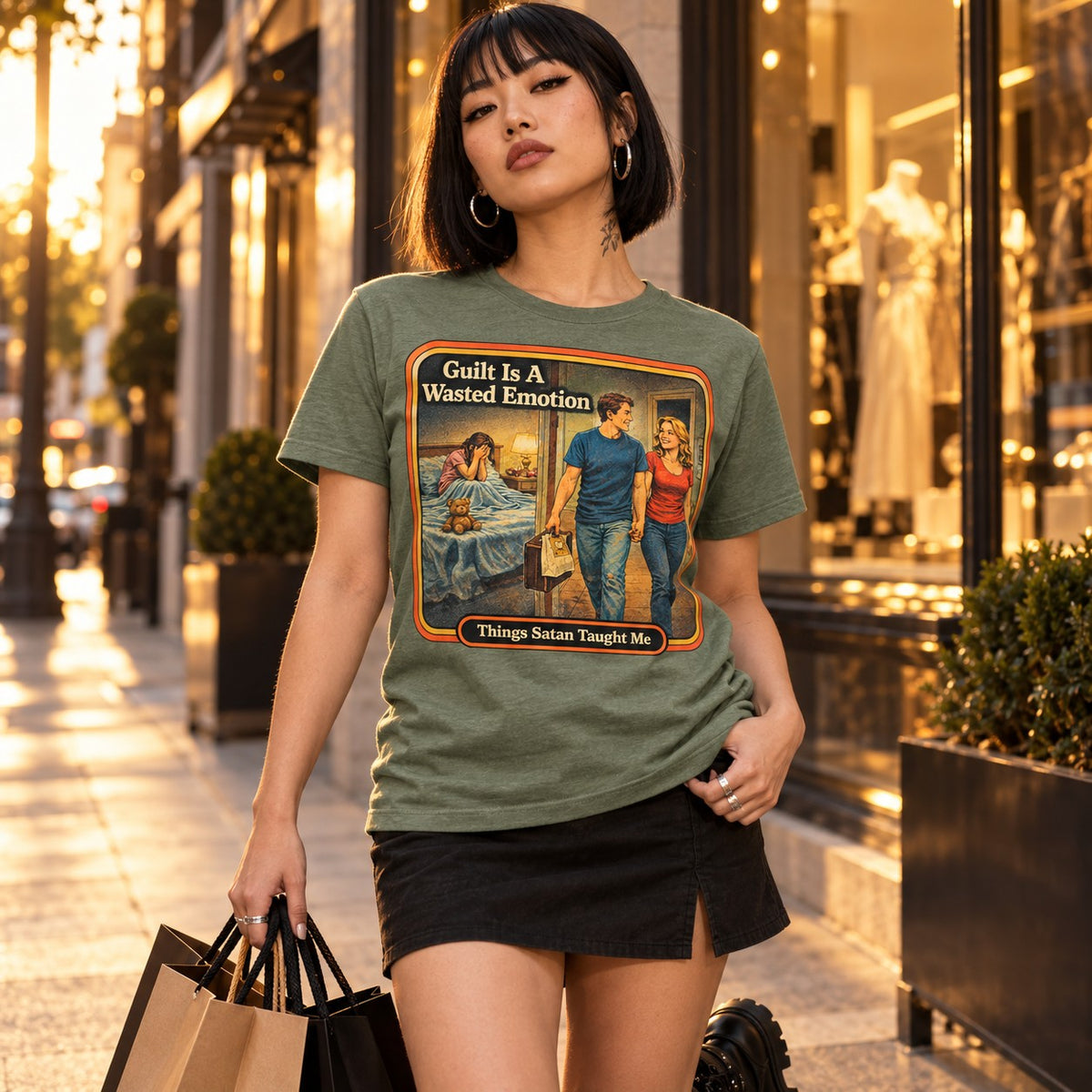 Model wearing the Guilt Is A Wasted Emotion tee in sage by Things Satan Taught Me