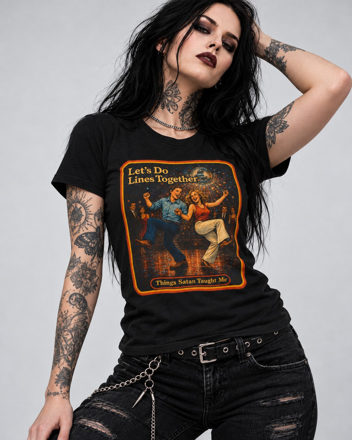 Model wearing the Let's Do Lines Together women's tee in black by Things Satan Taught Me