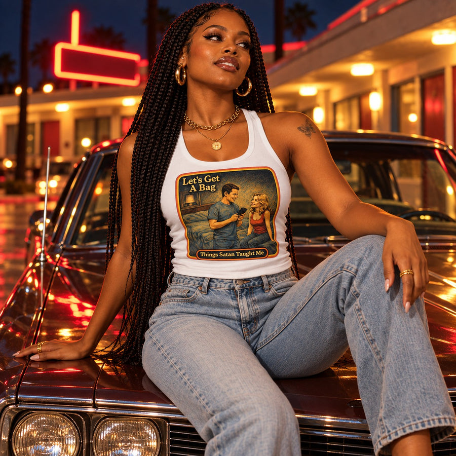 Model sitting in the Let's Get A Bag racerback tank in white by Things Satan Taught Me